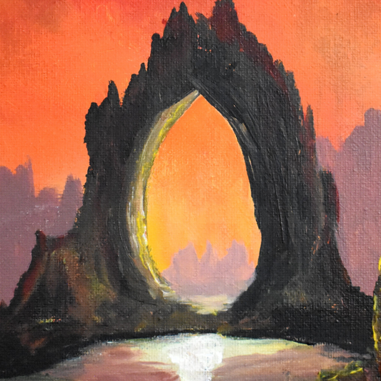 Rock formation with a glowing arch at sunset